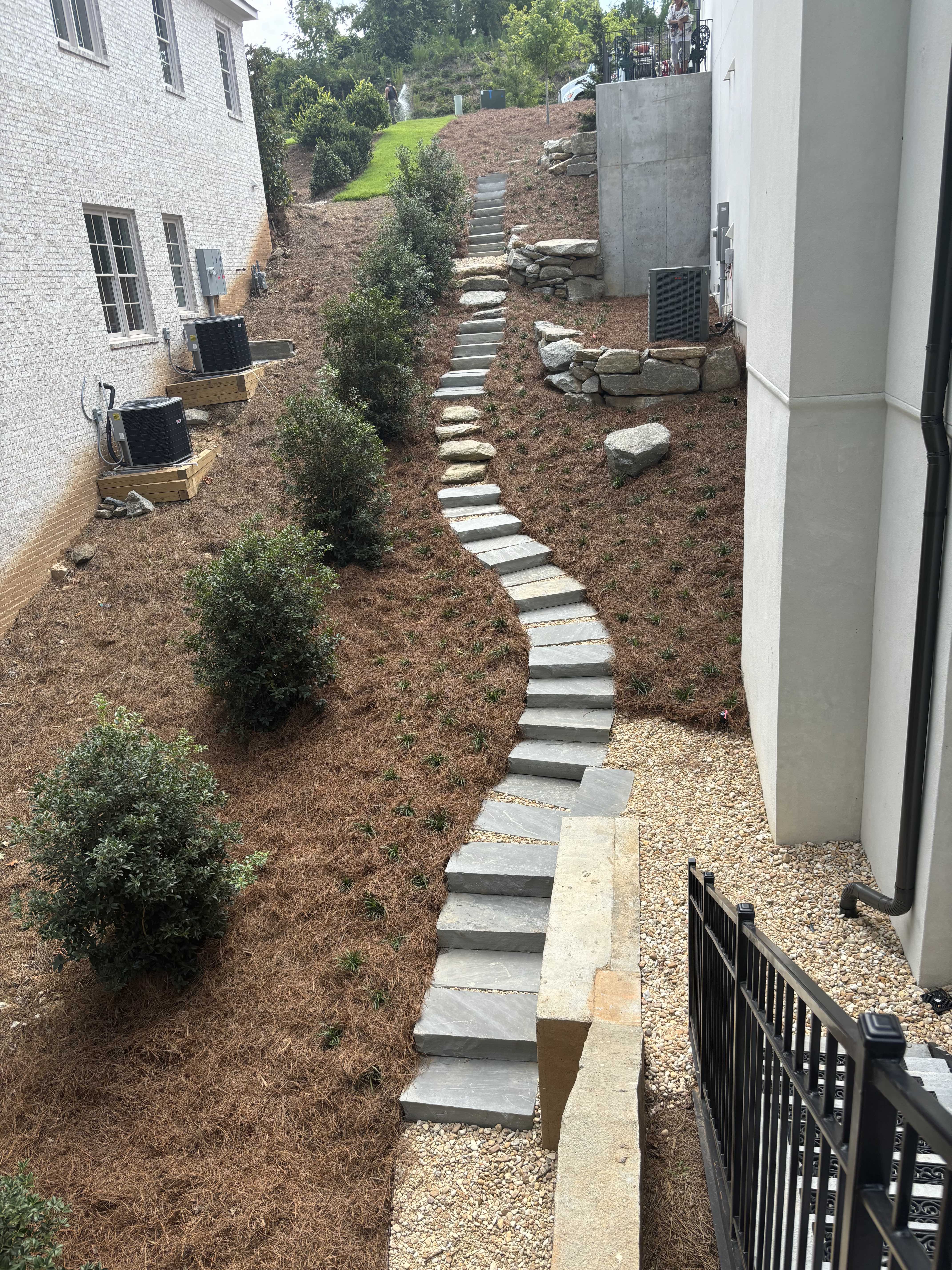 Curved flagstone pathway on hillside