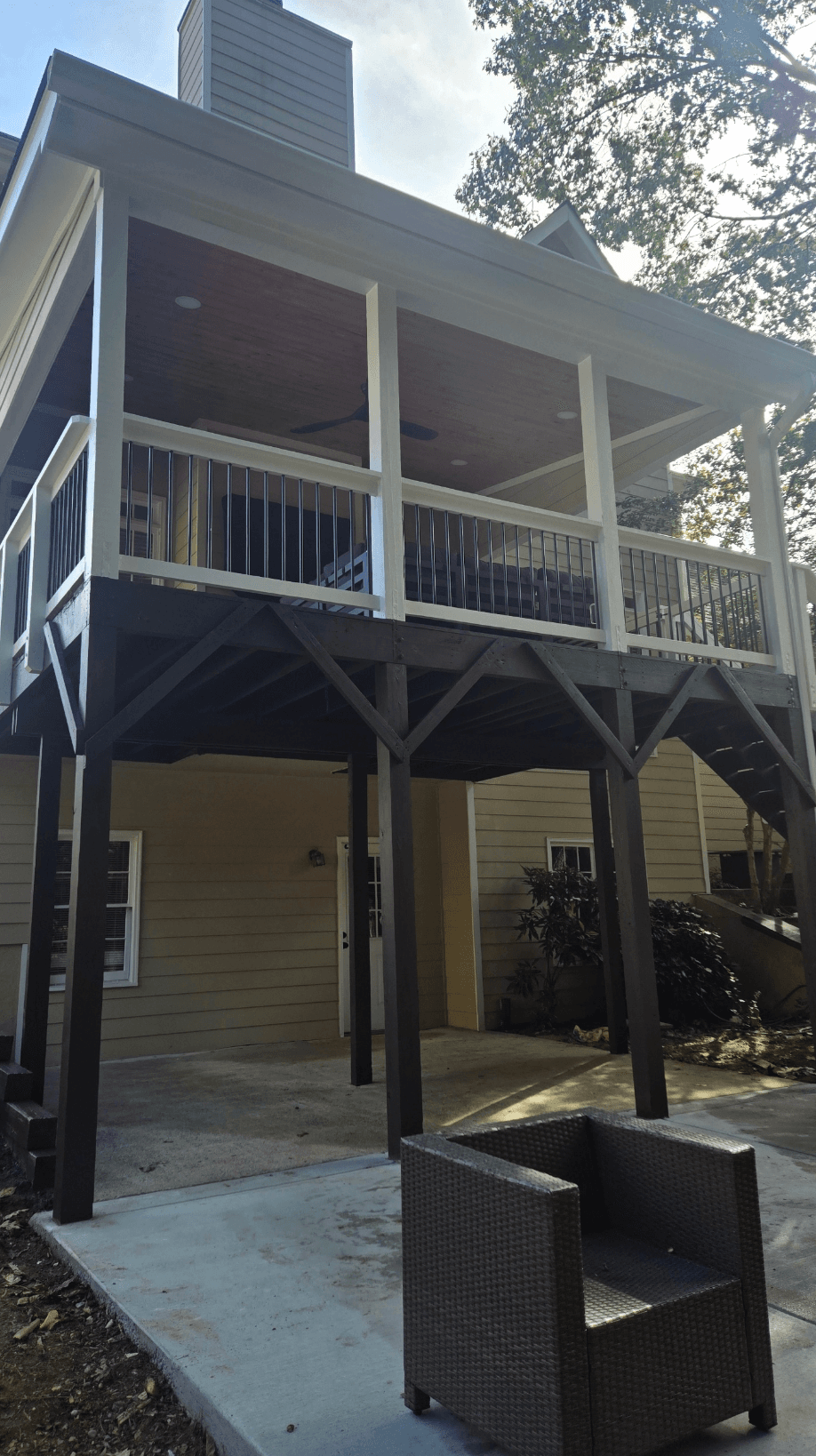 Two-story covered porch with cedar ceiling