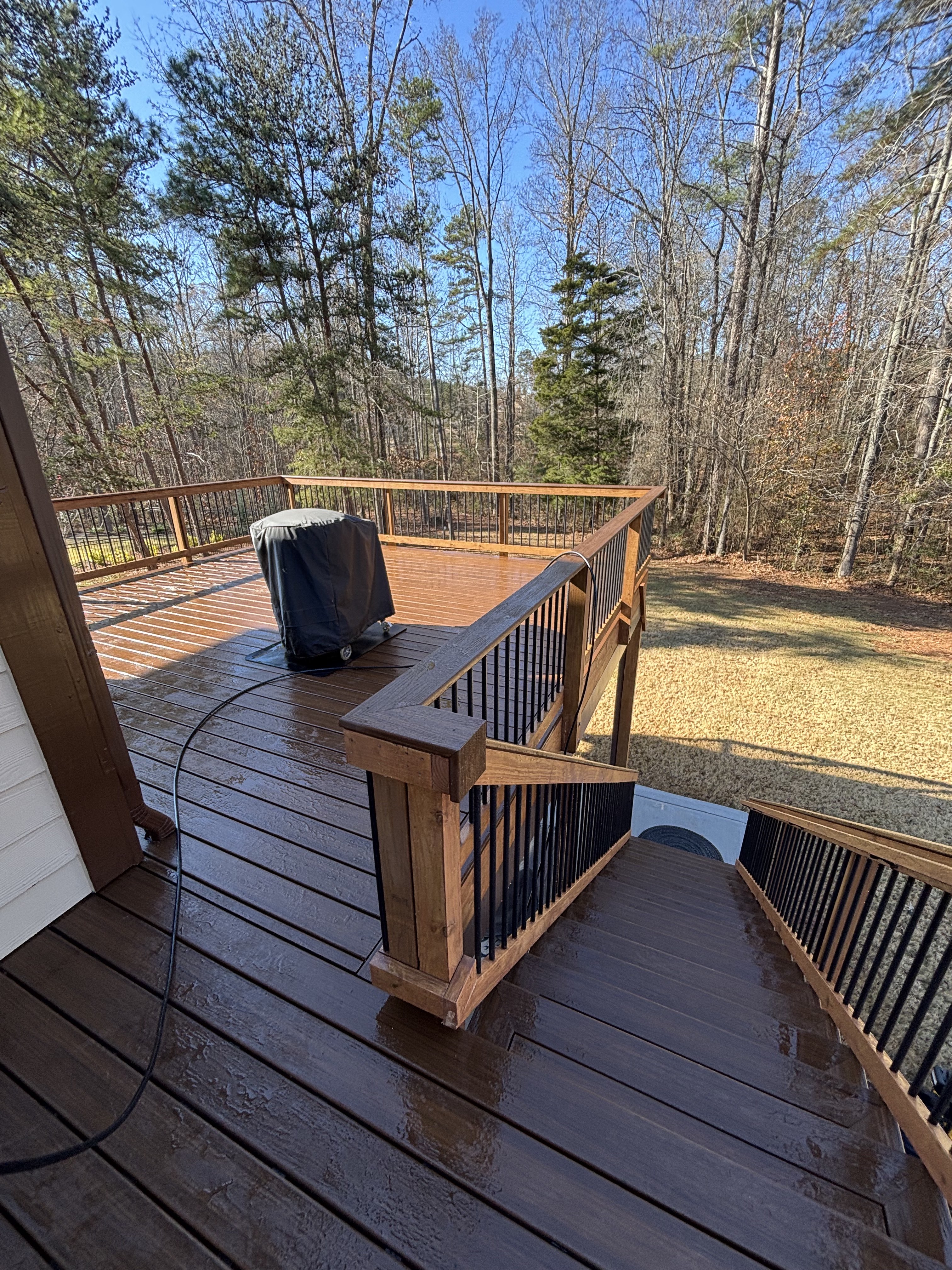 Multi-level stained wood deck with stairs