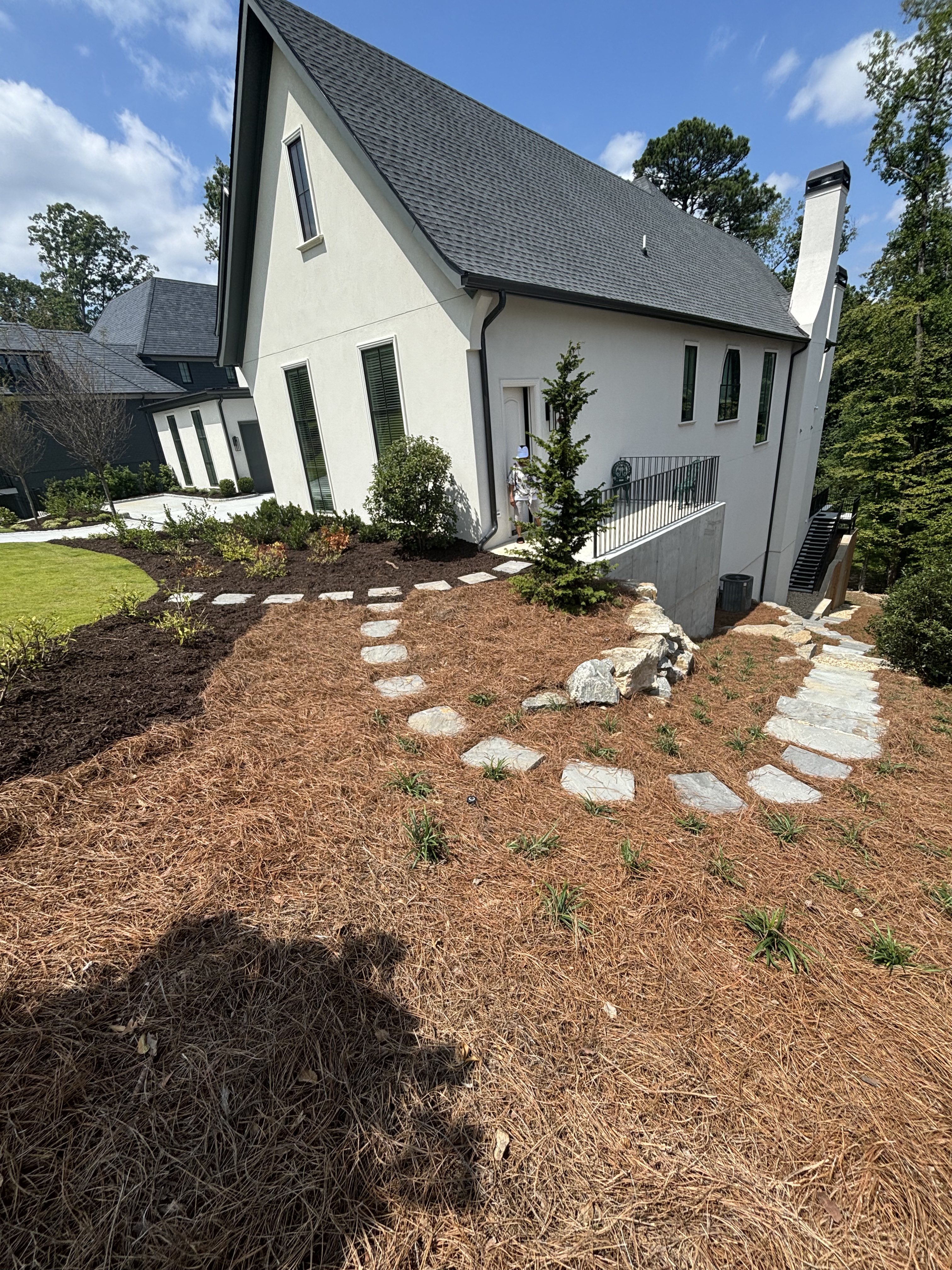 Natural flagstone stepping stones through pine straw