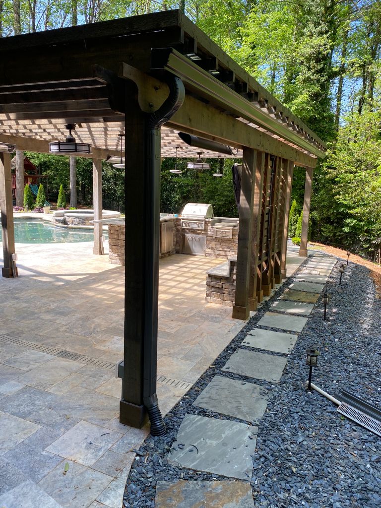 Double pergola structure with outdoor kitchen