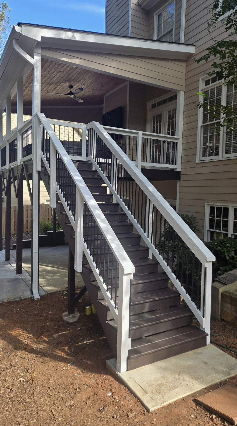 Two-story elevated porch with grand staircase