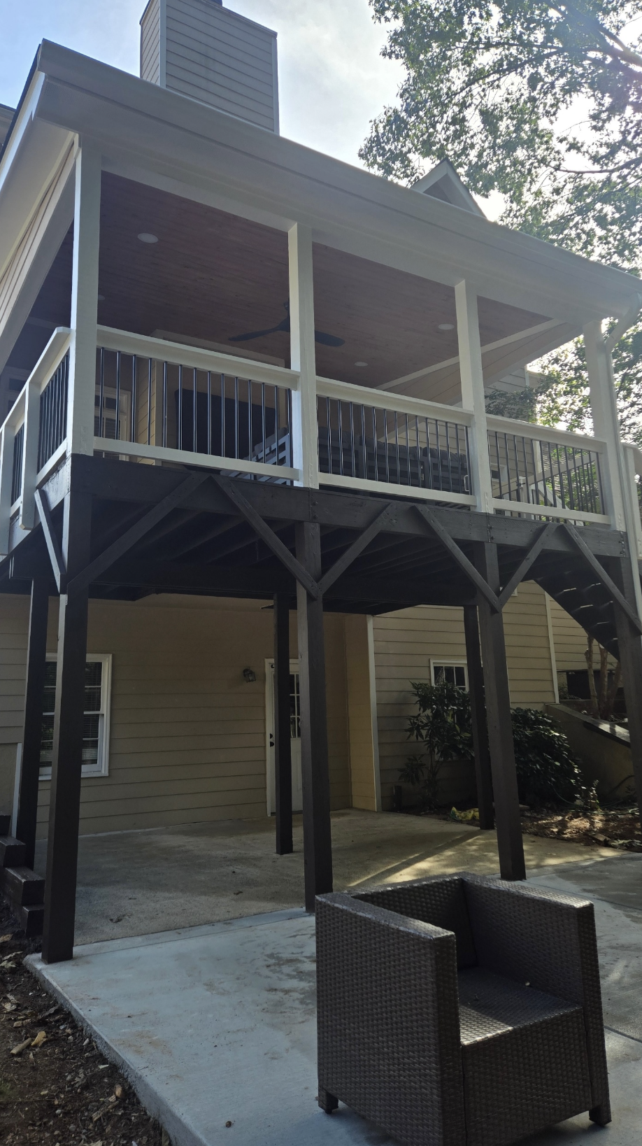 Two-story covered porch with cedar ceiling