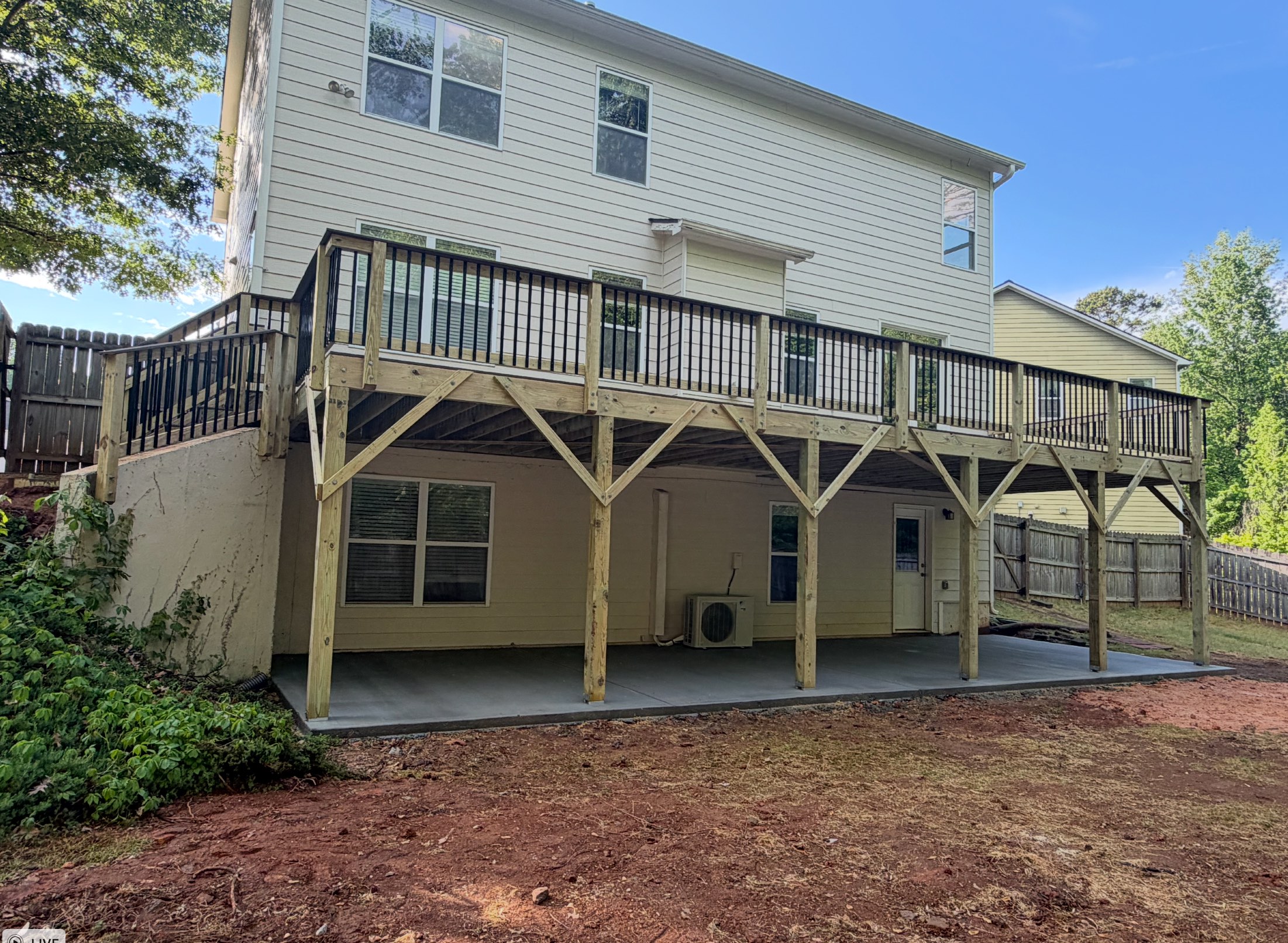 Large elevated pressure-treated deck with X-bracing