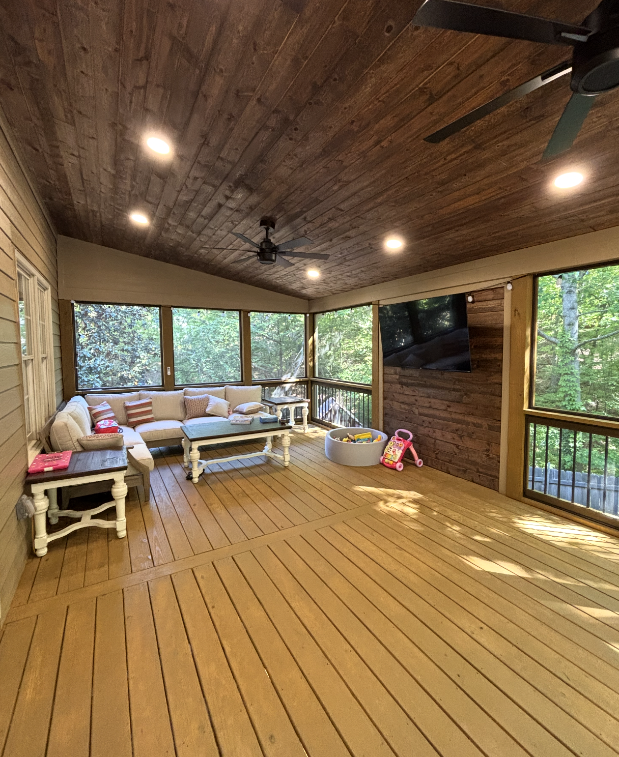Luxurious screened porch with tongue-and-groove ceiling and sectional
