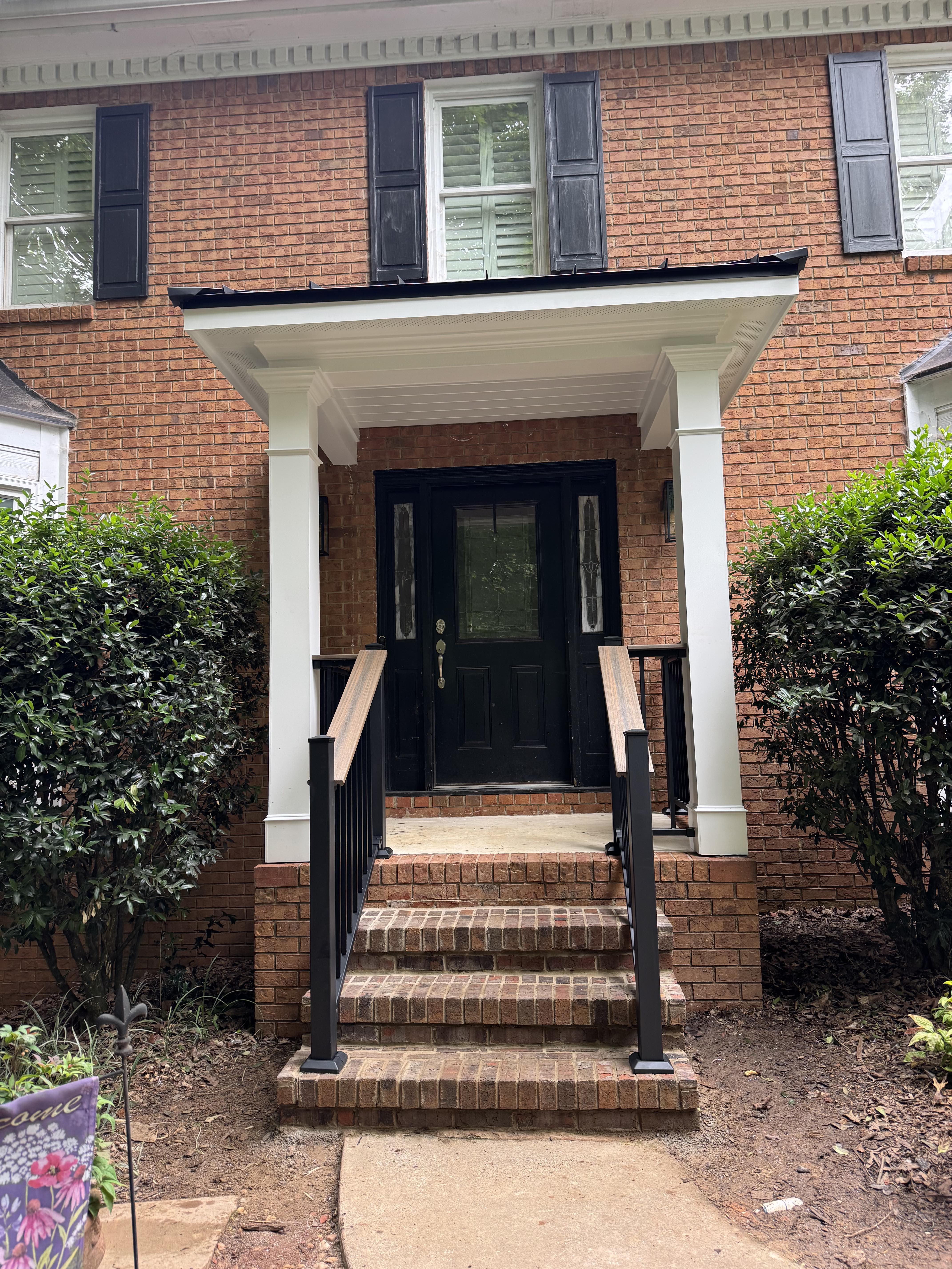 Classic brick home with white columned portico